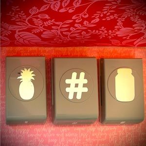 Three large paper punches.